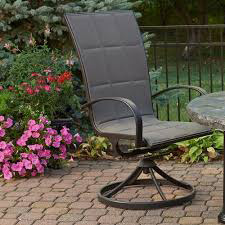 Outdoor chair with fabric padding and arms sits on a round swivel base