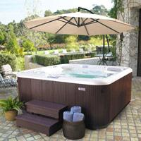 Brown hot tub with spa side umbrella providing shade overhead