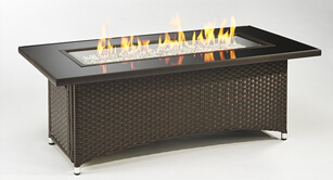 Rectangular gas fire pit with clear fire glass and row of flames