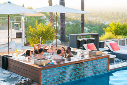 8 friends gathered together in a hot tub