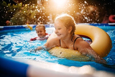 Kids Swimming In Pool