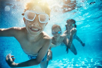 Kids Swimming Underwater